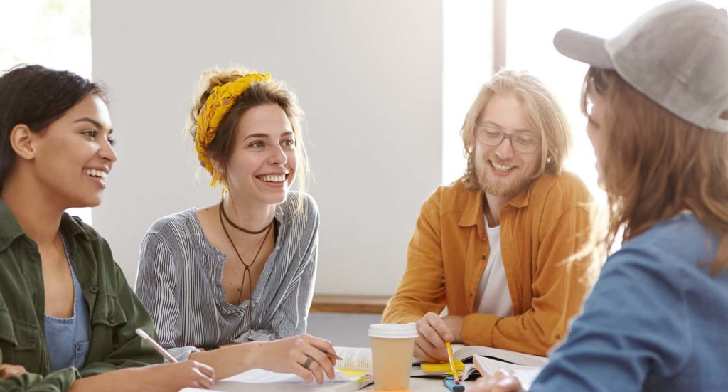 Adult students engaging in a conversation class