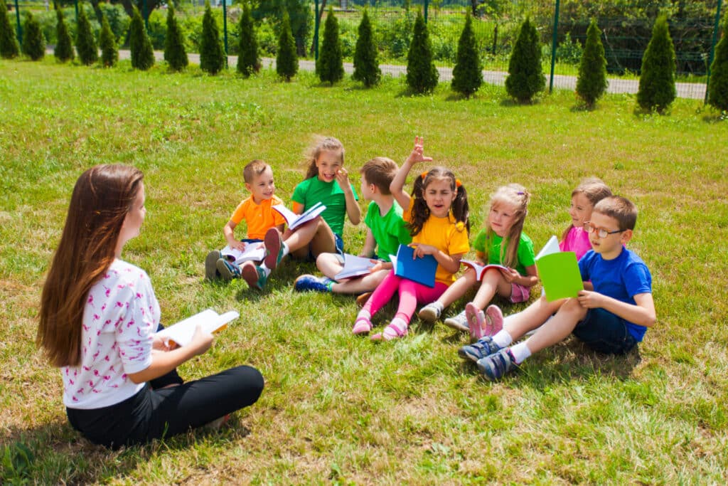 A TEFL teacher and learners on a summer camp in the UK