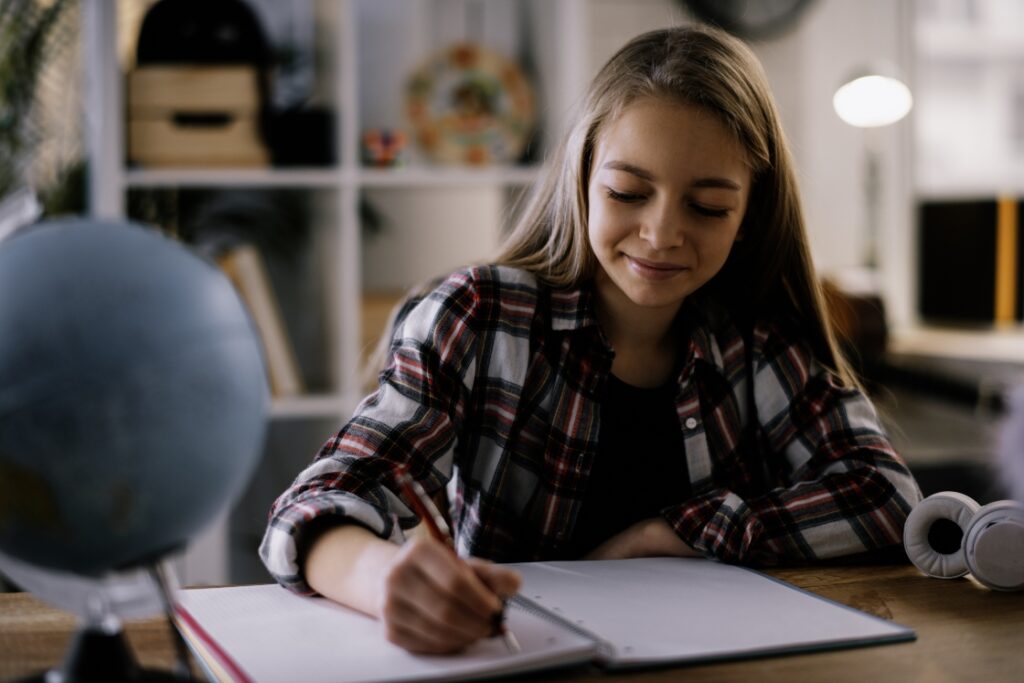 EFL student sitting at a desk, doing work